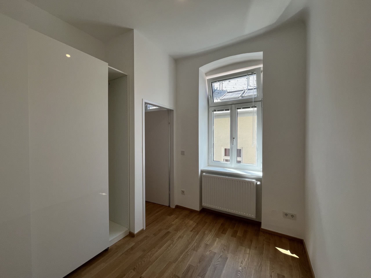 Finished room with restored floor and window